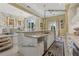 Open-concept kitchen with a large island, double touch faucets, and ample counter space at 7540 Shadburn Ferry Rd, Cumming, GA 30041