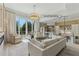 Bright living room with glass railings and access to outdoor deck at 7540 Shadburn Ferry Rd, Cumming, GA 30041