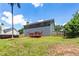This home has a large backyard with a partial privacy fence, mature trees and a wooden deck off of the back at 209 Courtland Oaks Sw Dr, Marietta, GA 30060