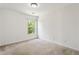 Simple bedroom featuring a window and neutral carpeting at 209 Courtland Oaks Sw Dr, Marietta, GA 30060
