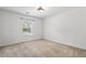 Bedroom featuring a window and neutral carpeting at 209 Courtland Oaks Sw Dr, Marietta, GA 30060