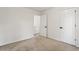 Bedroom with an open closet and view into an adjoining room at 209 Courtland Oaks Sw Dr, Marietta, GA 30060