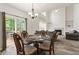 Dining area with views of a vaulted living room and sliding door access to the backyard at 209 Courtland Oaks Sw Dr, Marietta, GA 30060
