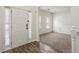 Bright entryway featuring wood-look floors and an open view to a carpeted living space at 209 Courtland Oaks Sw Dr, Marietta, GA 30060