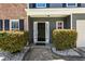 View of the front door and facade with neat landscaping at 209 Courtland Oaks Sw Dr, Marietta, GA 30060