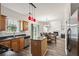 Well-lit kitchen with stainless steel appliances, an island and views of an open concept living space at 209 Courtland Oaks Sw Dr, Marietta, GA 30060