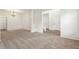 Bright living room features neutral walls, plush carpet, and wainscoting detail with a decorative chandelier at 209 Courtland Oaks Sw Dr, Marietta, GA 30060