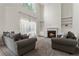 Inviting living room with a fireplace, built-in shelves, two-story ceilings, and lots of natural light at 209 Courtland Oaks Sw Dr, Marietta, GA 30060