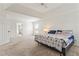 Spacious main bedroom with large windows and carpet floors at 209 Courtland Oaks Sw Dr, Marietta, GA 30060