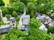 Aerial view showcasing a luxurious home with a pool, surrounded by lush greenery and beautiful landscaping at 4015 Wieuca Ne Rd, Atlanta, GA 30342