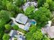 Aerial view showcases the property's pool, landscaping, and surrounding lush greenery at 4015 Wieuca Ne Rd, Atlanta, GA 30342