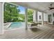 Inviting view of the pool from the back porch, showcasing the seamless indoor-outdoor living space at 4015 Wieuca Ne Rd, Atlanta, GA 30342