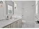 Bright bathroom featuring white subway tiles, marble countertop and stylish fixtures at 4015 Wieuca Ne Rd, Atlanta, GA 30342