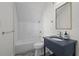 Bathroom features white subway tile in shower, blue vanity, and chrome fixtures at 4015 Wieuca Ne Rd, Atlanta, GA 30342