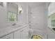 Bright bathroom featuring white subway tiles, marble countertop and stylish fixtures at 4015 Wieuca Ne Rd, Atlanta, GA 30342