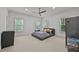 Spacious bedroom with neutral carpet, ceiling fan, and natural light from multiple windows at 4015 Wieuca Ne Rd, Atlanta, GA 30342