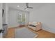 Serene bedroom with hardwood floors, natural light, and minimalist decor at 4015 Wieuca Ne Rd, Atlanta, GA 30342