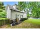 Charming home exterior with a spacious lawn, manicured landscaping, and a private pool area at 4015 Wieuca Ne Rd, Atlanta, GA 30342