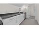 Kitchenette features white cabinets, dark countertops, and stainless steel mini-fridge at 4015 Wieuca Ne Rd, Atlanta, GA 30342