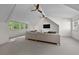 Spacious, bright living room with vaulted ceilings, ceiling fans, and neutral carpet at 4015 Wieuca Ne Rd, Atlanta, GA 30342