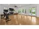 Bright living room with fireplace, hardwood floors, and access to outdoor space at 4015 Wieuca Ne Rd, Atlanta, GA 30342