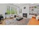 Stylish living room boasts built-in shelving, a fireplace, and ample natural light at 4015 Wieuca Ne Rd, Atlanta, GA 30342