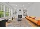 Stylish living room boasts built-in shelving, a fireplace, and ample natural light at 4015 Wieuca Ne Rd, Atlanta, GA 30342