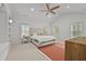 Spacious main bedroom with ceiling fan, vaulted ceiling, and many windows at 4015 Wieuca Ne Rd, Atlanta, GA 30342