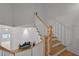 Bright wooden staircase with white risers, railing and a contemporary style at 4015 Wieuca Ne Rd, Atlanta, GA 30342