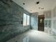 This spacious bathroom features beautiful tile and a bright window, perfect for a relaxing retreat at 101 Deer Canyon Dr, Auburn, GA 30011