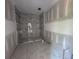 Tiled bathroom featuring an open shower, enhancing the room's modern feel at 101 Deer Canyon Dr, Auburn, GA 30011