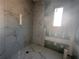Modern bathroom features stylish tile, a window, and contemporary fixtures for a spa-like experience at 101 Deer Canyon Dr, Auburn, GA 30011