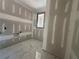 Bathroom with marble tile flooring and large window at 101 Deer Canyon Dr, Auburn, GA 30011