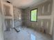 Bathroom with standing shower area and large window at 101 Deer Canyon Dr, Auburn, GA 30011
