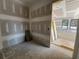 Unfinished bedroom with raw drywall, a window, and potential for customization at 101 Deer Canyon Dr, Auburn, GA 30011