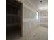 Bedroom featuring an open door and a window that provides natural light at 101 Deer Canyon Dr, Auburn, GA 30011