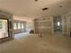 Open-concept living space with large windows and stair access at 101 Deer Canyon Dr, Auburn, GA 30011