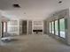 Large unfinished living room with multiple windows offering ample natural light and recessed lighting at 101 Deer Canyon Dr, Auburn, GA 30011