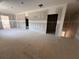 Spacious living room features an open floor plan and multiple doorways, creating an inviting atmosphere at 101 Deer Canyon Dr, Auburn, GA 30011