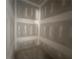 This room is unfinished with fresh drywall, awaiting your design vision to come to life at 101 Deer Canyon Dr, Auburn, GA 30011