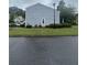 Side view of home with manicured lawn and tidy landscaping at 3414 Bayshore Dr, Atlanta, GA 30340