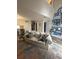 Inviting living room with a comfortable sofa, decorative pillows, and a vibrant area rug at 3414 Bayshore Dr, Atlanta, GA 30340