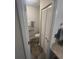 Compact half bathroom with a toilet and closet at 3414 Bayshore Dr, Atlanta, GA 30340