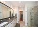 Modern bathroom features double sinks, walk-in glass shower and tile floors at 422 Laurel Spring Ct, Canton, GA 30114