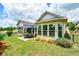 Well-manicured backyard with an outdoor patio and beautiful, lush landscaping at 422 Laurel Spring Ct, Canton, GA 30114