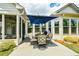 A beautiful home exterior with an outdoor patio, dining set, and a grill at 422 Laurel Spring Ct, Canton, GA 30114