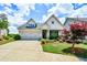 Charming home with a well-manicured front yard and a two-car garage at 422 Laurel Spring Ct, Canton, GA 30114