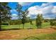 Picturesque golf course view showcasing lush green fairways and manicured landscaping at 422 Laurel Spring Ct, Canton, GA 30114