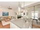 Open kitchen with island seating flowing into the living and dining areas at 422 Laurel Spring Ct, Canton, GA 30114