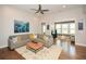 Spacious living room with hardwood floors, a grey sectional sofa, and decor at 422 Laurel Spring Ct, Canton, GA 30114